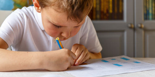 A schoolboy drawing on paper